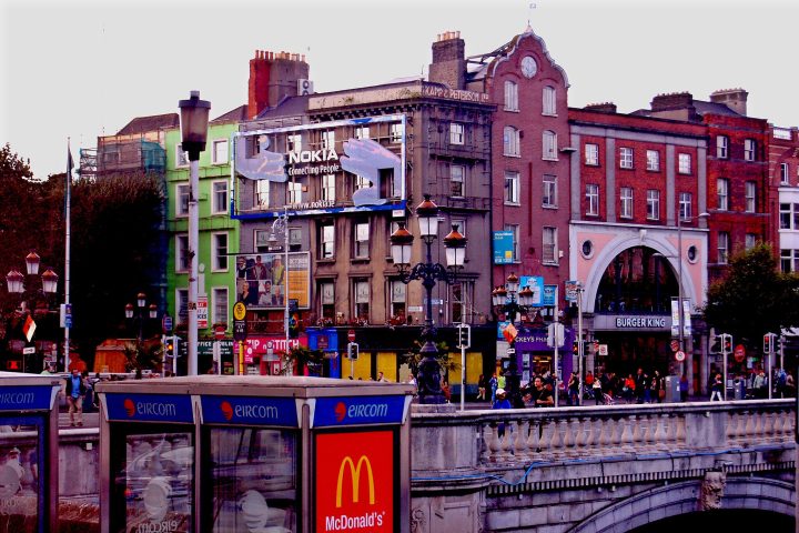 Houses in Dublin, Ireland, covered in adverts for tech companies.